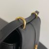 FENDI C’mon Mini. Embrace Elegance: Stefano Pilati's Curvaceous Creation. A petite satchel bag, graced with graceful, feminine curves, represents a masterpiece from the illustrious collection envisioned by the renowned Stefano Pilati. Fashioned from sumptuously smooth leather, this exquisite piece is adorned with meticulously embossed accents and edges, culminating in a striking FF logo proudly showcased on its elegant flap.