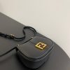 FENDI C’mon Mini. Embrace Elegance: Stefano Pilati's Curvaceous Creation. A petite satchel bag, graced with graceful, feminine curves, represents a masterpiece from the illustrious collection envisioned by the renowned Stefano Pilati. Fashioned from sumptuously smooth leather, this exquisite piece is adorned with meticulously embossed accents and edges, culminating in a striking FF logo proudly showcased on its elegant flap.