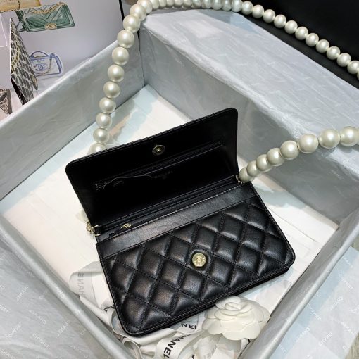 Chanel Wallet on Chain (WOC) Pearls. Original Quality Bag including gift box, care book, dust bag, authenticity card. This style is part of Chanel’s Fall/Winter 2020 Collection. The classic lambskin wallet on chain gets a chic new update with a strap adorned with imitation pearls. It is available in the regular size. The pearl strap is one of the most popular designs from the collection. Chanel’s iconic pearls brings in an elegant touch on the casual WOC. It can be worn as an everyday bag or used as an evening bag.