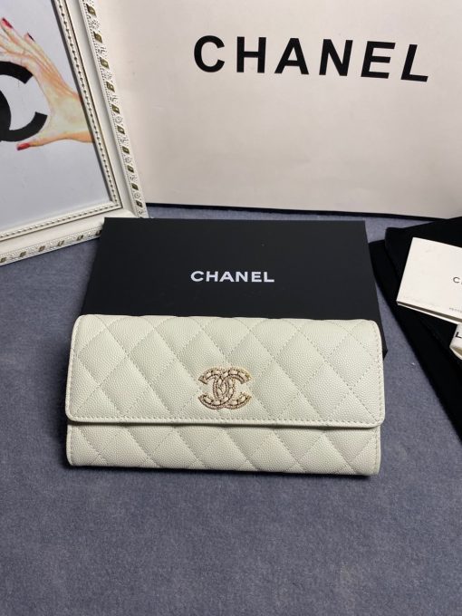 CHANEL CC Logo Flap Wallet. Original Quality Wallet including gift box, care book, dust bag, authenticity card. This latest wallet from CHANEL is crafted in luxurious quilted grained calfskin with a stylish Chanel CC logo. The wallet opens to a leather interior with card slots and a zippered compartment.