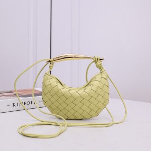 BOTTEGA VENETA Mini Sardine. Crafted to Perfection, Inspired by Nature: Your Timeless Companion for All Occasions. Bottega Veneta's masterful intrecciato weaving technique was originally crafted to ensure the enduring quality of leather goods. The Sardine Mini leather shoulder bag, meticulously fashioned from supple lamb leather, showcases a distinctive top handle reminiscent of a graceful fish. This versatile piece seamlessly transitions from day to night, making it the perfect, reliable companion to elegantly accommodate all your essentials.