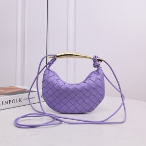 BOTTEGA VENETA Mini Sardine. Crafted to Perfection, Inspired by Nature: Your Timeless Companion for All Occasions. Bottega Veneta's masterful intrecciato weaving technique was originally crafted to ensure the enduring quality of leather goods. The Sardine Mini leather shoulder bag, meticulously fashioned from supple lamb leather, showcases a distinctive top handle reminiscent of a graceful fish. This versatile piece seamlessly transitions from day to night, making it the perfect, reliable companion to elegantly accommodate all your essentials.