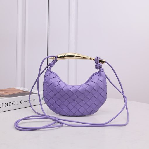 BOTTEGA VENETA Mini Sardine. Crafted to Perfection, Inspired by Nature: Your Timeless Companion for All Occasions. Bottega Veneta's masterful intrecciato weaving technique was originally crafted to ensure the enduring quality of leather goods. The Sardine Mini leather shoulder bag, meticulously fashioned from supple lamb leather, showcases a distinctive top handle reminiscent of a graceful fish. This versatile piece seamlessly transitions from day to night, making it the perfect, reliable companion to elegantly accommodate all your essentials.