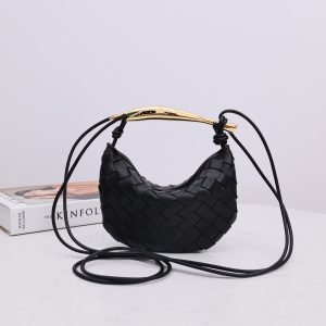 BOTTEGA VENETA Mini Sardine. Crafted to Perfection, Inspired by Nature: Your Timeless Companion for All Occasions. Bottega Veneta's masterful intrecciato weaving technique was originally crafted to ensure the enduring quality of leather goods. The Sardine Mini leather shoulder bag, meticulously fashioned from supple lamb leather, showcases a distinctive top handle reminiscent of a graceful fish. This versatile piece seamlessly transitions from day to night, making it the perfect, reliable companion to elegantly accommodate all your essentials.