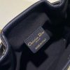 DIOR Small C'est Bag: Timeless Elegance, Effortless Style. Introducing the C'est Dior bag, a timeless and elegant creation for Fall 2023. Crafted in natural and denim blue raffia, it beautifully features the classic Marinière motif from ready-to-wear. Securing your essentials with a sophisticated CD Lock closure adorned with a twisting letter D, this bucket bag combines style with practicality. With a top handle and an adjustable, removable chain strap featuring a leather insert, this small-sized bag offers versatile carrying options—be it hand-held or comfortably draped over the shoulder.