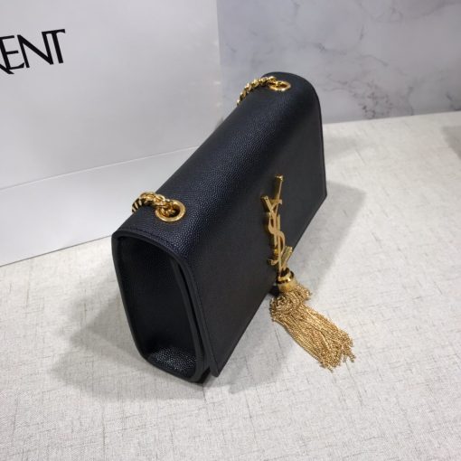 SAINT LAURENT Small 'Kate' Bag with Tassel. Original Quality Bag including gift box, care book, dust bag, authenticity card. Monogram Saint Laurent bag adorned with a curb chain, interlocking YSL initials in metal, and a metallic tassel. Crafted from leather, this Kate shoulder bag from Saint Laurent is decorated with a signature YSL monogram plaque and a hanging tassel detail to the front for an extra refined touch. The perfect go-to for a night out. Featuring a chain shoulder strap, a foldover top with magnetic closure, a main internal compartment, an internal slip pocket, an internal logo patch, an internal logo stamp, and metal hardware.