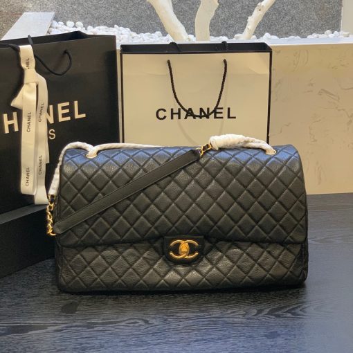 CHANEL XXL Runway Travel Classic Flap Bag. Authentic Quality Bag with literature, dust bag, fabric flower, and authenticity card. This Chanel Classic Maxi Flap Bag is crafted from black caviar leather and finished with silver hardware. The bag features the iconic cc turncock front closure and is lined in the classic Bordeaux leather lining. The bag features a zip pocket under the flap, black pocket, and interior 2 pockets.