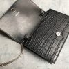 SAINT LAURENT Small 'Kate' Bag with Tassel. Original Quality Bag including gift box, care book, dust bag, authenticity card. Monogram Saint Laurent bag adorned with a curb chain, interlocking YSL initials in metal, and a metallic tassel. Crafted from leather, this Kate shoulder bag from Saint Laurent is decorated with a signature YSL monogram plaque and a hanging tassel detail to the front for an extra refined touch. The perfect go-to for a night out. Featuring a chain shoulder strap, a foldover top with magnetic closure, a main internal compartment, an internal slip pocket, an internal logo patch, an internal logo stamp, and metal hardware.