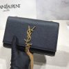 SAINT LAURENT Small 'Kate' Bag with Tassel. Original Quality Bag including gift box, care book, dust bag, authenticity card. Monogram Saint Laurent bag adorned with a curb chain, interlocking YSL initials in metal, and a metallic tassel. Crafted from leather, this Kate shoulder bag from Saint Laurent is decorated with a signature YSL monogram plaque and a hanging tassel detail to the front for an extra refined touch. The perfect go-to for a night out. Featuring a chain shoulder strap, a foldover top with magnetic closure, a main internal compartment, an internal slip pocket, an internal logo patch, an internal logo stamp, and metal hardware.