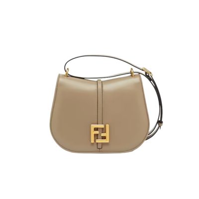 C’mon Medium. Timeless Elegance, Embodied in Leather. Elegantly designed, this medium-sized satchel bag boasts graceful, curved lines that exude femininity. Its elongated flap is adorned with a striking metal FF logo, adding a touch of sophistication to its overall charm. Crafted from supple leather with meticulously embossed edges and intricate details, this bag radiates a sense of refined luxury. The sides of the bag seamlessly blend with the overall design, crafted from the same tone-on-tone full-grain leather, ensuring a harmonious and visually pleasing aesthetic.