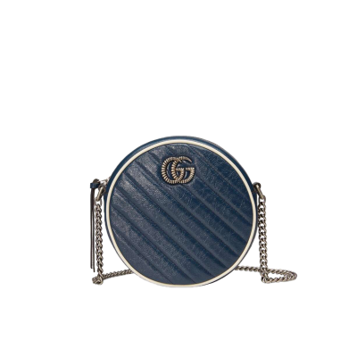 GUCCI GG Marmont Mini Leather Round Shoulder Bag. This Gucci GG Marmont mini round shoulder bag certainly seems to fit the bill! Mini bags are hot this season and we could be more supportive of this trend. This bag from Gucci is only for essentials, the phone will be on your hands, the credit card in your pocket and your lipstick have a 24-hour duration. Crafted from plain/quilted leather, this fun-size accessory has a chain and leather shoulder strap and is adorned with the signature metal GG logo. All the best things come in small packages. Featuring a top zip fastening and gold-tone/silver-tone hardware.