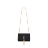 SAINT LAURENT Small 'Kate' Bag with Tassel. Original Quality Bag including gift box, care book, dust bag, authenticity card. Monogram Saint Laurent bag adorned with a curb chain, interlocking YSL initials in metal, and a metallic tassel. Crafted from leather, this Kate shoulder bag from Saint Laurent is decorated with a signature YSL monogram plaque and a hanging tassel detail to the front for an extra refined touch. The perfect go-to for a night out. Featuring a chain shoulder strap, a foldover top with magnetic closure, a main internal compartment, an internal slip pocket, an internal logo patch, an internal logo stamp, and metal hardware.
