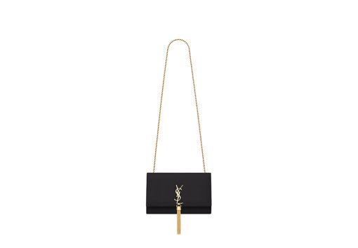 SAINT LAURENT Small 'Kate' Bag with Tassel. Original Quality Bag including gift box, care book, dust bag, authenticity card. Monogram Saint Laurent bag adorned with a curb chain, interlocking YSL initials in metal, and a metallic tassel. Crafted from leather, this Kate shoulder bag from Saint Laurent is decorated with a signature YSL monogram plaque and a hanging tassel detail to the front for an extra refined touch. The perfect go-to for a night out. Featuring a chain shoulder strap, a foldover top with magnetic closure, a main internal compartment, an internal slip pocket, an internal logo patch, an internal logo stamp, and metal hardware.