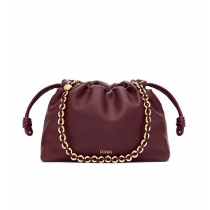 *OEWE Medium Flamenco Purse: Elegant Sophistication. Meet the Flamenco Purse – where timeless style meets modern elegance. Defined by its beautifully ruched design and signature side knots, this medium-sized bag is crafted from soft, supple nappa lambskin. It's the perfect blend of luxurious texture and sophisticated detailing, making it an essential accessory for any wardrobe.