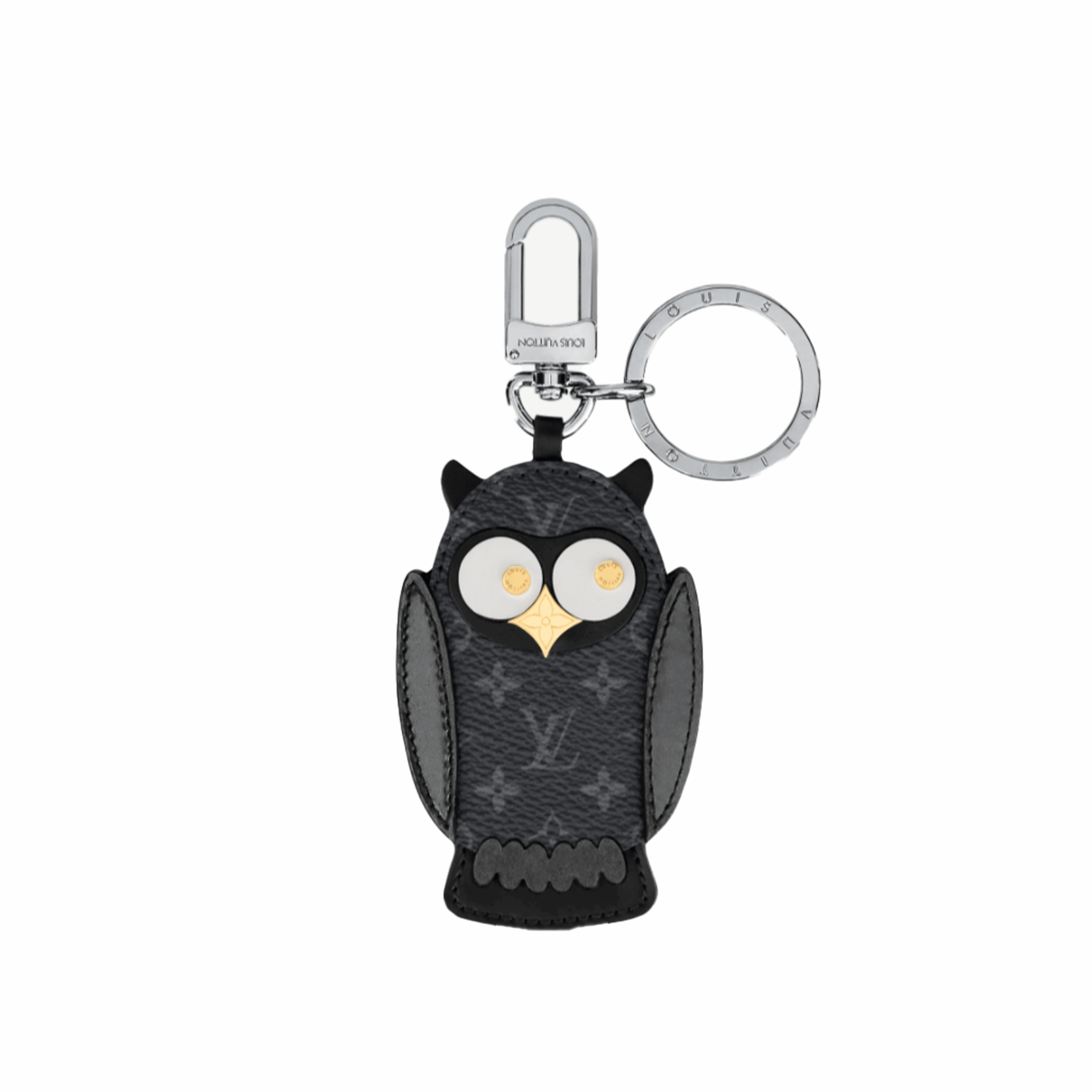 Owl Bag-Charm & Key Holder 15 LOUIS VUITTON Owl Bag-Charm & Key Holder. Original Quality Charm including gift box, care book, dust bag, authenticity card. The mascot on the Owl bag charm and key holder is brought to life with LV studs for eyes and a Monogram Flower beak. Gold-color hardware joins calf leather and Monogram Eclipse canvas in a playful mingling of the House's signature materials. The hook and ring on this are both engraved with the Louis Vuitton signature for an elegant finish.