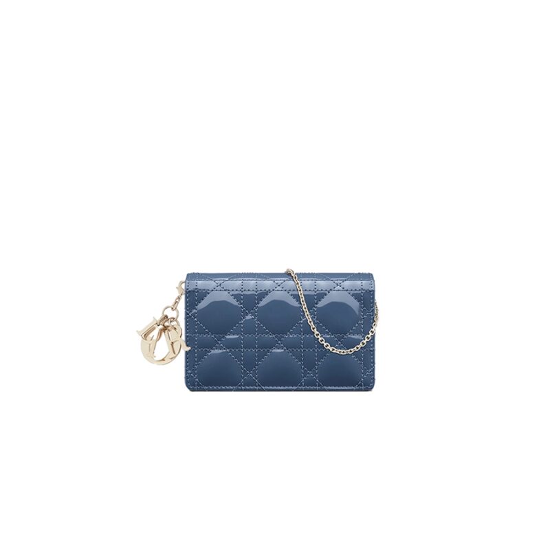 DIOR ‘Lady Dior’ Nano Pouch. Original Quality Pouch including gift box, care book, dust bag, authenticity card. This Nano Pouch is an elegant and modern accessory, highlighted by its instantly recognizable quilted pattern. Crafted in lambskin (also available in different leathers), it features a metallic 'D.I.O.R.' charm on its flap and its interior compartment holds keys and coins. This versatile piece can be worn crossbody with its removable chain strap or with a belt that may be inserted through its rear loops, allowing for daily use.