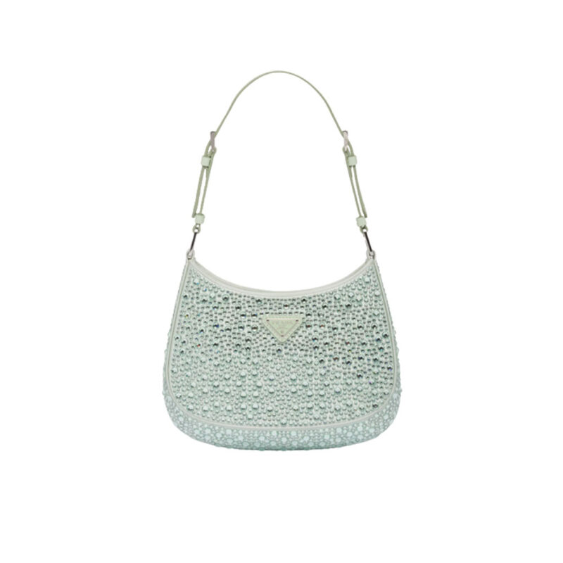 PRADA Cleo Satin Bag With Crystals. Original Quality Bag including gift box, care book, dust bag, authenticity card. Feminine, elegant and modern, the Prada Cleo bag is made of satin and embellished with luminous crystals of different sizes that give the bag refined charm. The sinuous shape that recalls archive styles makes the accessory iconic.