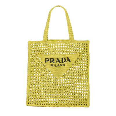 Crochet Tote Bag. Elevate your style with Prada's signature tote bag. This tote bag is the perfect addition to any summer wardrobe! Adorned with Prada's iconic triangle logo and embroidered lettering, its soft, deconstructed design is made with a light and natural raffia-effect yarn. It's sure to add an elevated touch to your ensemble.