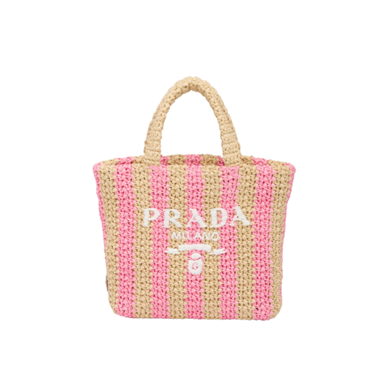 Small Crochet Tote Bag. Elevate Your Look with an Exquisite Tote Bag! This exquisite tote bag has a deconstructed design made of a light, natural material with a summery mood, raffia-effect yarn. Embroidered lettering logo decorates the front, and the emblematic triangle in enameled metal is the perfect finishing touch to the side.