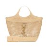ST *RENT ICare In Raffia: Handcrafted Elegance with Versatile Style. Introducing the Maxi Shopping Bag, exquisitely crafted from hand-embroidered natural raffia. This exceptional piece showcases the finest savoir-faire and specialized craftsmanship. Adorned with an oversized, sculptural Cassandre, the bag features an inner chain that can be used to adjust the sides for versatile styling. Additionally, it comes with a removable raffia sunglasses case, elegantly attached by a long chain, blending functionality with high fashion.