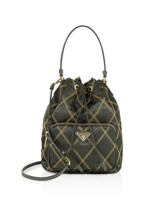 PRADA Quilted Bucket Bag. Original Quality Bag including gift box, care book, dust bag, authenticity card. PRADA nylon bucket bag with tessuto-impunturato quilted topstitching. Leather top handle. Drawstring top. Detachable Shoulder Strap. Front Zip Pocket with logo plate.