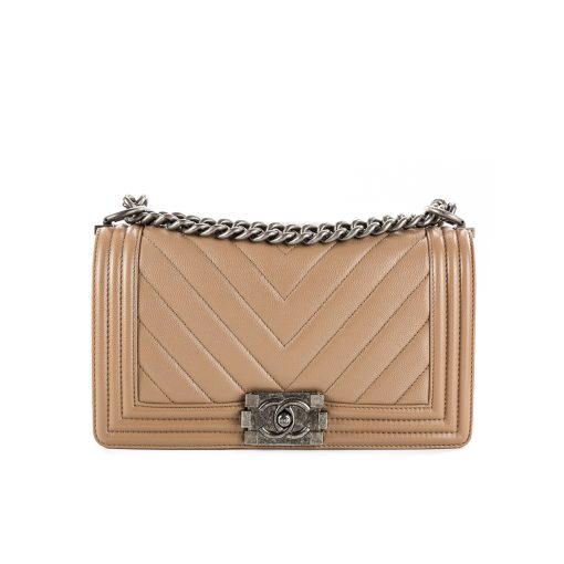 CHANEL Chevron Quilted Leather Flap Bag. Original high quality bag. Authentic design. Original quality printed dust bag and sales box. Created by Karl Lagerfeld, the iconic design owes its name to Gabrielle Chanel's first love, Boy Capel. This Chanel Boy Flap Bag Quilted is every woman's dream. Crafted from calfskin leather, the bag features Chanel's signature chevron quilting, chunky chain link strap with leather shoulder pad, and metal-tone hardware accents. Its CC Boy logo closure opens to a fabric-lined interior with slip pocket perfect for daily essentials. A sought-after, luxurious accessory.