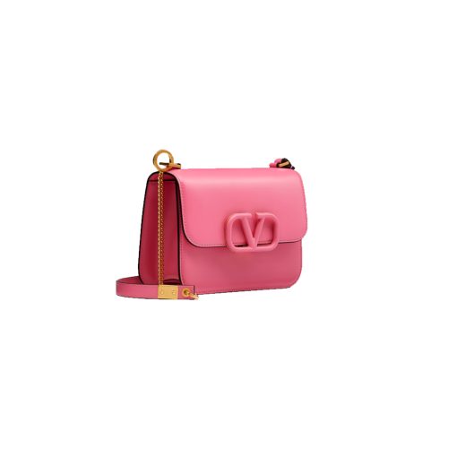 VALENTINO VSling Mini Leather Shoulder Bag. Authentic Quality Bag with literature, gift box, dust bag and authenticity card. The label's new V Ring logo, we've got to admit that we were like 'Rockstuds who? Pierpaolo Picciolil employs clean lines and considered details for Valentino's SS20 accessories offering and this orange leather V-logo bag is the elegant result. It's crafted with an adjustable cross-body strap and the namesake logo plaque across the front flap, then opens to reveal a black leather interior with a single slip pocket. Style it over the body of a blouse tucked into a midi skirt.