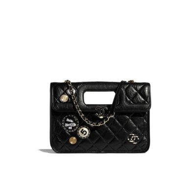 CHANEL Flap Bag with Charms, best high-end quality bag with gift box, dust bag, authenticity card, and CHANEL cloth flower. We love the square-shaped design with a built-in handle for hand carry. Charms give the bag a Punk feel. The center features the CC logo and a woven leather chain strap allows for shoulder carry.