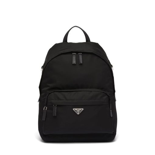 PRADA Black Logo Plaque Nylon and Saffiano Leather Backpack. Original Quality Bag including gift box, literature, dust bag, authenticity card. Practicality is key but style is always appreciated, too. Detailed with the brand's signature enameled triangle logo plaque to the front for an extra refined touch, this backpack from Prada is the perfect go-to for whenever you need to carry everything but the kitchen sink. Best of both worlds.