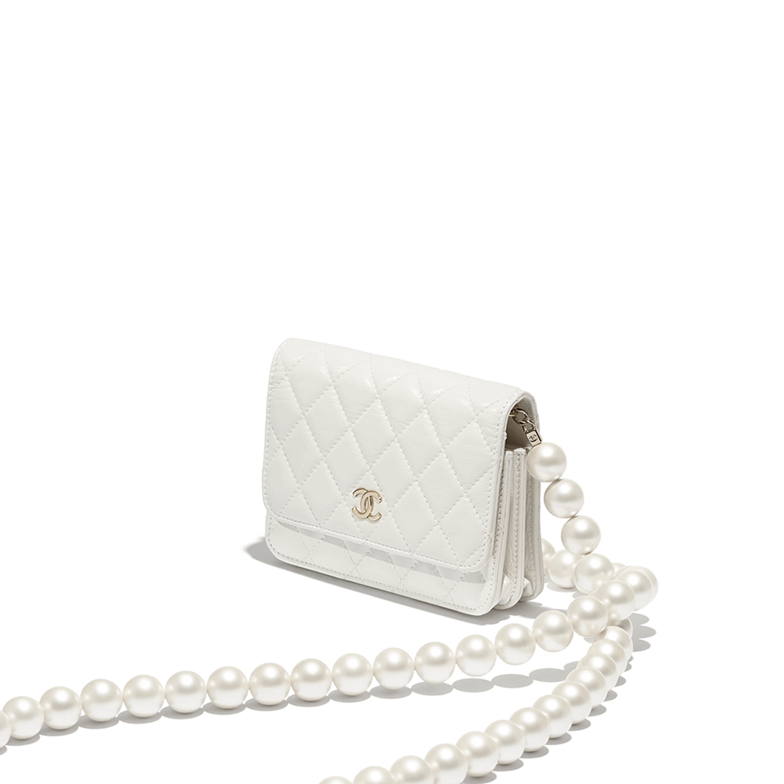 Imitation Pearls Wallet on Chain 1 Chanel Wallet on Chain (WOC) Pearls. Original Quality Bag including gift box, care book, dust bag, authenticity card. This style is part of Chanel’s Fall/Winter 2020 Collection. The classic lambskin wallet on chain gets a chic new update with a strap adorned with imitation pearls. It is available in the regular size. The pearl strap is one of the most popular designs from the collection. Chanel’s iconic pearls brings in an elegant touch on the casual WOC. It can be worn as an everyday bag or used as an evening bag.