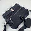 PRADA Nylon Cross-Body Bag. Original Quality Bag including gift box, care book, dust bag, authenticity card. This bag decorated with Saffiano leather trim presents compact volumes and a sleek design. With its distinctive side release buckle on the front, it comes with an easily adjustable shoulder strap. This cross-body bag featuring Saffiano leather trim with metal hardware and Prada logo lining, logo tag inside, enameled metal triangle logo outside. It has a main compartment with zipper, secondary compartment with flap and side release buckle, two front pockets, including one with zipper.