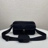 PRADA Nylon Cross-Body Bag. Original Quality Bag including gift box, care book, dust bag, authenticity card. This bag decorated with Saffiano leather trim presents compact volumes and a sleek design. With its distinctive side release buckle on the front, it comes with an easily adjustable shoulder strap. This cross-body bag featuring Saffiano leather trim with metal hardware and Prada logo lining, logo tag inside, enameled metal triangle logo outside. It has a main compartment with zipper, secondary compartment with flap and side release buckle, two front pockets, including one with zipper.