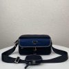 PRADA Nylon Cross-Body Bag. Original Quality Bag including gift box, care book, dust bag, authenticity card. This bag decorated with Saffiano leather trim presents compact volumes and a sleek design. With its distinctive side release buckle on the front, it comes with an easily adjustable shoulder strap. This cross-body bag featuring Saffiano leather trim with metal hardware and Prada logo lining, logo tag inside, enameled metal triangle logo outside. It has a main compartment with zipper, secondary compartment with flap and side release buckle, two front pockets, including one with zipper.