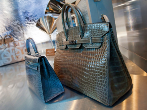 A luxury boutique with handbags displayed like rare artifacts.
