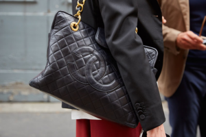 Stylish mom receiving a CHANEL-inspired purse for Mother’s Day