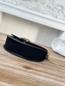 Marcie Chain Flap Bag. Authentic quality luxury bag crafted in genuine leather comes with authenticity card, dust bag and gift bag. Elevating Iconic Elegance: Marcie Line Redefined. Experience a fresh take on *loé's iconic Marcie line with this exquisite chain flap bag, meticulously crafted from a captivating blend of nappa lambskin, grained calfskin, and sumptuous suede. The line's signature hardware undergoes a graceful transformation, now adorned with *loé's engraved jewelry hallmark, adorning the flap with sophistication. An intricately hand-braided top handle pays homage to another hallmark Marcie feature, while a gracefully extended chain strap adds a refined touch. Whether you choose to drape it over your shoulder or wear it cross-body during the day, or opt to detach the strap and carry it by hand for a sophisticated evening ensemble, this flap bag is a versatile masterpiece. *loé's Marcie bag line effortlessly melds a feminine aesthetic with the free-spirited vibe of the '70s. An equestrian-inspired allure takes center stage, elevated by the allure of gleaming gold-toned hardware, resulting in a distinctly feminine yet timelessly chic look. | PURSE POP UP LIVE Marcie Chain Flap Bag. Authentic quality luxury bag crafted in genuine leather comes with authenticity card, dust bag and gift bag. Elevating Iconic Elegance: Marcie Line Redefined. Experience a fresh take on *loé's iconic Marcie line with this exquisite chain flap bag, meticulously crafted from a captivating blend of nappa lambskin, grained calfskin, and sumptuous suede. The line's signature hardware undergoes a graceful transformation, now adorned with *loé's engraved jewelry hallmark, adorning the flap with sophistication. An intricately hand-braided top handle pays homage to another hallmark Marcie feature, while a gracefully extended chain strap adds a refined touch. Whether you choose to drape it over your shoulder or wear it cross-body during the day, or opt to detach the strap and carry it by hand for a sophisticated evening ensemble, this flap bag is a versatile masterpiece. *loé's Marcie bag line effortlessly melds a feminine aesthetic with the free-spirited vibe of the '70s. An equestrian-inspired allure takes center stage, elevated by the allure of gleaming gold-toned hardware, resulting in a distinctly feminine yet timelessly chic look.