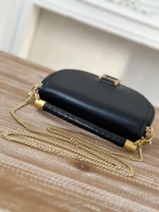 Marcie Chain Flap Bag. Authentic quality luxury bag crafted in genuine leather comes with authenticity card, dust bag and gift bag. Elevating Iconic Elegance: Marcie Line Redefined. Experience a fresh take on *loé's iconic Marcie line with this exquisite chain flap bag, meticulously crafted from a captivating blend of nappa lambskin, grained calfskin, and sumptuous suede. The line's signature hardware undergoes a graceful transformation, now adorned with *loé's engraved jewelry hallmark, adorning the flap with sophistication. An intricately hand-braided top handle pays homage to another hallmark Marcie feature, while a gracefully extended chain strap adds a refined touch. Whether you choose to drape it over your shoulder or wear it cross-body during the day, or opt to detach the strap and carry it by hand for a sophisticated evening ensemble, this flap bag is a versatile masterpiece. *loé's Marcie bag line effortlessly melds a feminine aesthetic with the free-spirited vibe of the '70s. An equestrian-inspired allure takes center stage, elevated by the allure of gleaming gold-toned hardware, resulting in a distinctly feminine yet timelessly chic look. | PURSE POP UP LIVE Marcie Chain Flap Bag. Authentic quality luxury bag crafted in genuine leather comes with authenticity card, dust bag and gift bag. Elevating Iconic Elegance: Marcie Line Redefined. Experience a fresh take on *loé's iconic Marcie line with this exquisite chain flap bag, meticulously crafted from a captivating blend of nappa lambskin, grained calfskin, and sumptuous suede. The line's signature hardware undergoes a graceful transformation, now adorned with *loé's engraved jewelry hallmark, adorning the flap with sophistication. An intricately hand-braided top handle pays homage to another hallmark Marcie feature, while a gracefully extended chain strap adds a refined touch. Whether you choose to drape it over your shoulder or wear it cross-body during the day, or opt to detach the strap and carry it by hand for a sophisticated evening ensemble, this flap bag is a versatile masterpiece. *loé's Marcie bag line effortlessly melds a feminine aesthetic with the free-spirited vibe of the '70s. An equestrian-inspired allure takes center stage, elevated by the allure of gleaming gold-toned hardware, resulting in a distinctly feminine yet timelessly chic look.