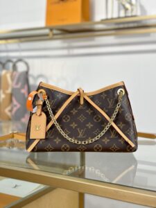 CarryAll BB. Authentic quality luxury bag crafted in genuine leather comes with authenticity card, dust bag and gift bag. Effortless Elegance, Day to Night – The CarryAll BB Reimagined. The iconic CarryAll BB returns this season with a stylish twist, perfect for transitioning from day to evening. Expertly crafted from the House’s signature Monogram canvas, it’s elevated with a gleaming gold-toned chain adorned with Monogram Flowers. Thoughtful details like the contrasting leather name tag and matching lace closure add a refined touch. Inside, a zipped pocket offers a convenient spot to keep your everyday essentials—like a credit card—close at hand.