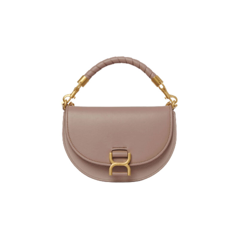Marcie Chain Flap Bag. Authentic quality luxury bag crafted in genuine leather comes with authenticity card, dust bag and gift bag. Elevating Iconic Elegance: Marcie Line Redefined. Experience a fresh take on *loé's iconic Marcie line with this exquisite chain flap bag, meticulously crafted from a captivating blend of nappa lambskin, grained calfskin, and sumptuous suede. The line's signature hardware undergoes a graceful transformation, now adorned with *loé's engraved jewelry hallmark, adorning the flap with sophistication. An intricately hand-braided top handle pays homage to another hallmark Marcie feature, while a gracefully extended chain strap adds a refined touch. Whether you choose to drape it over your shoulder or wear it cross-body during the day, or opt to detach the strap and carry it by hand for a sophisticated evening ensemble, this flap bag is a versatile masterpiece. *loé's Marcie bag line effortlessly melds a feminine aesthetic with the free-spirited vibe of the '70s. An equestrian-inspired allure takes center stage, elevated by the allure of gleaming gold-toned hardware, resulting in a distinctly feminine yet timelessly chic look.