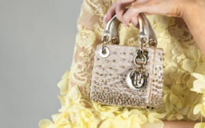 Gold clasp with engraved logo gleaming in soft light