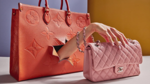 A dissected designer handbag illuminated on a workbench