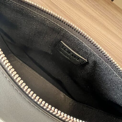 Mini Hammock Hobo. Authentic quality luxury bag crafted in genuine leather comes with authenticity card, dust bag and gift bag. Effortless Form, Everyday Function. The Mini Hammock Hobo is a contemporary reimagining of *oewe’s iconic Hammock bag. This streamlined variation offers a sleek, sculptural silhouette designed as a versatile sling bag for modern living. Expertly crafted in classic calfskin, it features soft, supple leather and a compact form that adapts effortlessly to your day. The unique design allows for multiple carry options—wear it crossbody, over the shoulder, or by hand. Elegant yet functional, this mini hobo is perfect for essentials, making it an ideal choice for both daily wear and minimalist style statements.