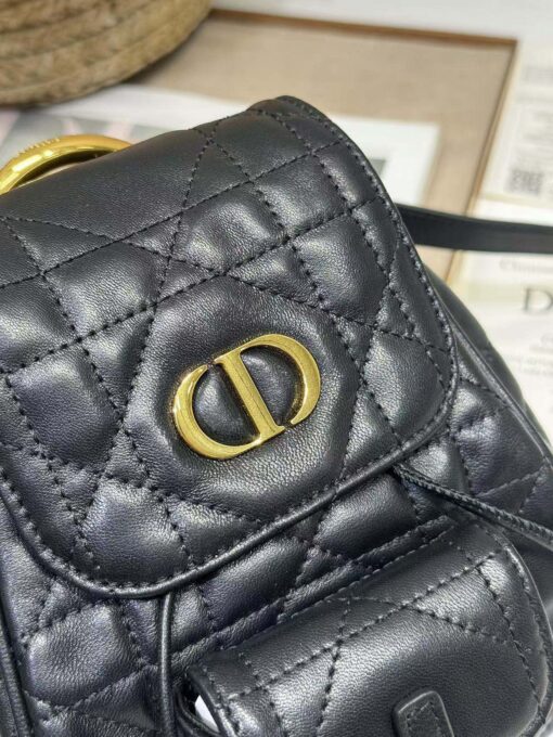 Small Caro Backpack. Authentic quality luxury bag crafted in genuine leather comes with authenticity card, dust bag and gift bag. Elegance Meets Effortless Edge. Elevate your everyday with the Small Caro Backpack — a flawless blend of modern femininity and iconic House craftsmanship. Luxuriously crafted in lambskin, its supple silhouette is enhanced by bold Macrocannage topstitching that whispers timeless *ior style. The antique gold-finish ‘CD’ clasp opens to a drawstring main compartment, perfectly balancing beauty and practicality. A discreet flap pocket keeps your daily essentials close at hand, while the top handle and adjustable leather straps offer versatile, all-day comfort. Whether slung over your shoulder or carried by hand, this petite powerhouse delivers Parisian polish in every step.