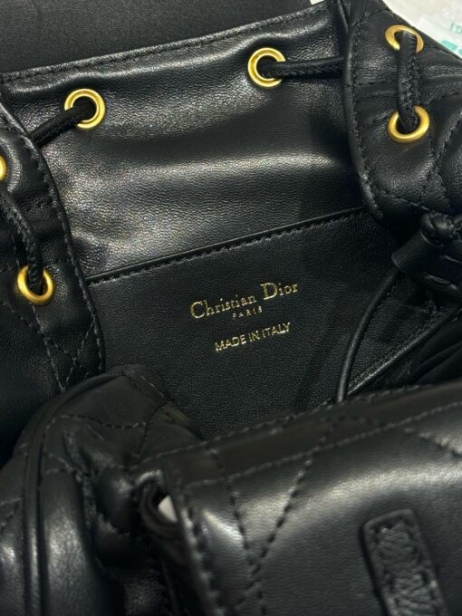 Small Caro Backpack. Authentic quality luxury bag crafted in genuine leather comes with authenticity card, dust bag and gift bag. Elegance Meets Effortless Edge. Elevate your everyday with the Small Caro Backpack — a flawless blend of modern femininity and iconic House craftsmanship. Luxuriously crafted in lambskin, its supple silhouette is enhanced by bold Macrocannage topstitching that whispers timeless *ior style. The antique gold-finish ‘CD’ clasp opens to a drawstring main compartment, perfectly balancing beauty and practicality. A discreet flap pocket keeps your daily essentials close at hand, while the top handle and adjustable leather straps offer versatile, all-day comfort. Whether slung over your shoulder or carried by hand, this petite powerhouse delivers Parisian polish in every step.