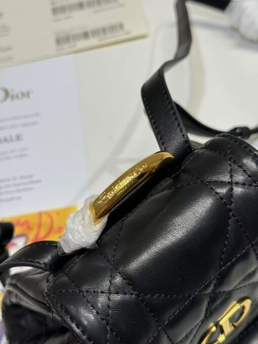 Small Caro Backpack. Authentic quality luxury bag crafted in genuine leather comes with authenticity card, dust bag and gift bag. Elegance Meets Effortless Edge. Elevate your everyday with the Small Caro Backpack — a flawless blend of modern femininity and iconic House craftsmanship. Luxuriously crafted in lambskin, its supple silhouette is enhanced by bold Macrocannage topstitching that whispers timeless *ior style. The antique gold-finish ‘CD’ clasp opens to a drawstring main compartment, perfectly balancing beauty and practicality. A discreet flap pocket keeps your daily essentials close at hand, while the top handle and adjustable leather straps offer versatile, all-day comfort. Whether slung over your shoulder or carried by hand, this petite powerhouse delivers Parisian polish in every step.