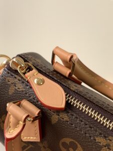 Speedy Nano. Authentic quality luxury bag crafted in genuine leather comes with authenticity card, dust bag and gift bag. Iconic Style, Perfectly Miniaturized. Meet the LV Speedy Nano — a petite powerhouse that captures the timeless allure of the iconic Speedy in its most charming form. Revamped in classic Monogram canvas and finished with aged natural cowhide leather, this mini marvel is made for the modern minimalist. Crafted with delicate gold-tone hardware and featuring two signature top handles, the Speedy Nano is both playful and practical. Its removable, adjustable shoulder strap adds effortless versatility—carry it by hand for polished poise or sling it crossbody for chic, on-the-go ease. Compact enough for your essentials. Iconic enough to turn heads. Small bag, big legacy!