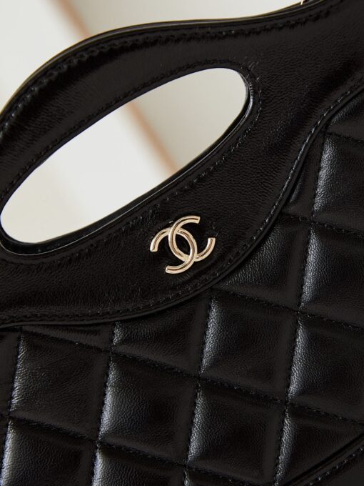 31 Nano Shopping Bag. Authentic quality luxury bag crafted in genuine leather comes with authenticity card, dust bag and gift bag. Small in size, grand in statement. A miniature marvel that captures the sophistication of *ANEL in its most playful form. Crafted with meticulous precision, this petite icon merges the timeless spirit of the *ANEL 31 with a modern twist on everyday elegance. Designed in supple lambskin and finished with gleaming gold-tone hardware, the Nano 31 doesn’t just carry your essentials — it carries your attitude. Whether worn crossbody, by hand, or dangling from the crook of your arm, this charming piece elevates every ensemble with a whisper of Parisian chic. Perfect for a night out or a day in the spotlight, it’s not just a bag — it’s your boldest accessory in its most compact form. Because luxury doesn't need to shout. Sometimes, it just needs to charm.