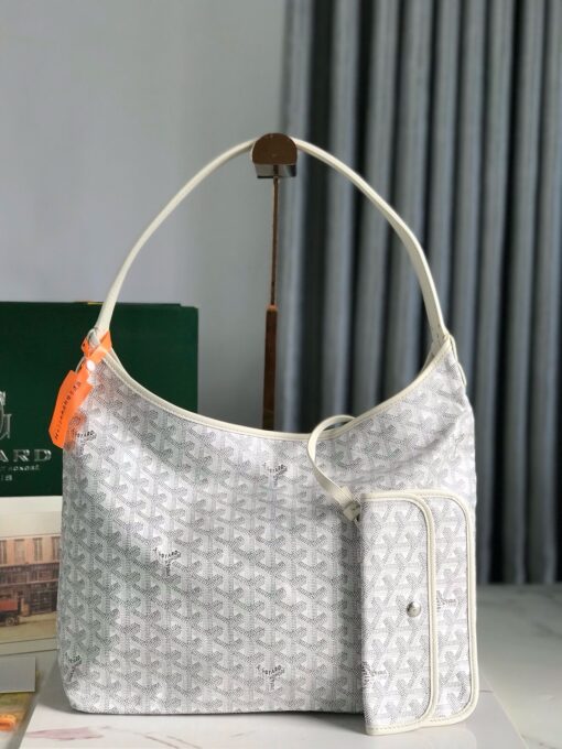 Bohème Hobo Bag. Authentic quality luxury bag crafted in genuine leather comes with authenticity card, dust bag and gift bag. Wander Freely. Carry Elegantly. Introducing the *yard Bohème Hobo Bag—a tribute to Parisian spirit and wanderlust. Inspired by the timber raftsmen’s humble travel pouches, this bag blends heritage storytelling with everyday luxury. Crafted to be exceptionally lightweight and flexible, it drapes effortlessly on your shoulder with a wide, comfortable handle designed for long city strolls or spontaneous weekend escapes. Its beauty lies not only in its sleek silhouette but also in its thoughtful functionality. The secure zip closure keeps your essentials safe, while the removable snap-fastened pouch doubles as a chic clutch or wallet—perfect for a quick dash or stylish switch-up. Whether you’re wandering through cobblestone streets or navigating your daily routine, the Bohème ensures your essentials are always within reach. This is not just a bag—it’s your elegant partner in carefree adventures.