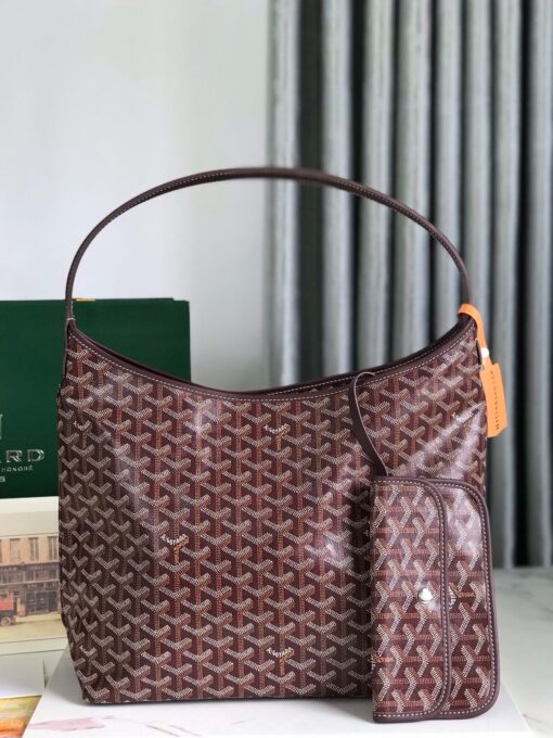 Bohème Hobo Bag. Authentic quality luxury bag crafted in genuine leather comes with authenticity card, dust bag and gift bag. Wander Freely. Carry Elegantly. Introducing the *yard Bohème Hobo Bag—a tribute to Parisian spirit and wanderlust. Inspired by the timber raftsmen’s humble travel pouches, this bag blends heritage storytelling with everyday luxury. Crafted to be exceptionally lightweight and flexible, it drapes effortlessly on your shoulder with a wide, comfortable handle designed for long city strolls or spontaneous weekend escapes. Its beauty lies not only in its sleek silhouette but also in its thoughtful functionality. The secure zip closure keeps your essentials safe, while the removable snap-fastened pouch doubles as a chic clutch or wallet—perfect for a quick dash or stylish switch-up. Whether you’re wandering through cobblestone streets or navigating your daily routine, the Bohème ensures your essentials are always within reach. This is not just a bag—it’s your elegant partner in carefree adventures.