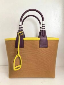 Steeple 25 Bag. Authentic quality luxury bag crafted in genuine leather comes with authenticity card, dust bag and gift bag. Where art meets heritage. The *rmès Steeple Bag is a charming fusion of heritage and artistry, crafted from a blend of canvas and Swift leather. Its design pays tribute to *rmès’ equestrian roots with whip-shaped handles and a stirrup-inspired charm, adding a playful yet sophisticated touch. Lightweight yet spacious, the Steeple is ideal for daily use. Whether you opt for a vibrant motif or a sleek, single-color design, this bag stands out as an artistic expression of luxury that seamlessly integrates into a modern lifestyle. Praised for its unique aesthetic and accessibility within the *rmès lineup, the Steeple Bag is adored by fashion enthusiasts who appreciate its colorful palette and bold personality. While it’s best suited for those who enjoy the texture and look of canvas, it remains a versatile statement piece that captures the spirit of everyday elegance. | PURSE POP UP LIVE Steeple 25 Bag. Authentic quality luxury bag crafted in genuine leather comes with authenticity card, dust bag and gift bag. Where art meets heritage. The *rmès Steeple Bag is a charming fusion of heritage and artistry, crafted from a blend of canvas and Swift leather. Its design pays tribute to *rmès’ equestrian roots with whip-shaped handles and a stirrup-inspired charm, adding a playful yet sophisticated touch. Lightweight yet spacious, the Steeple is ideal for daily use. Whether you opt for a vibrant motif or a sleek, single-color design, this bag stands out as an artistic expression of luxury that seamlessly integrates into a modern lifestyle. Praised for its unique aesthetic and accessibility within the *rmès lineup, the Steeple Bag is adored by fashion enthusiasts who appreciate its colorful palette and bold personality. While it’s best suited for those who enjoy the texture and look of canvas, it remains a versatile statement piece that captures the spirit of everyday elegance.